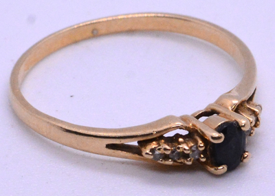 #ad 14 KT GOLD RING WITH BLACK STONE AND DIAMONDS 1.4 GRAMS SIZE 7 $249.00