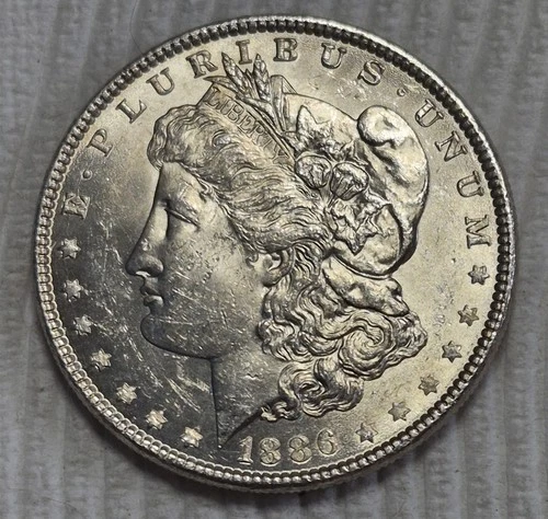 1886 P Morgan Silver Dollar. Die Cracks. Estimated Almost Uncirculated 58. A0502