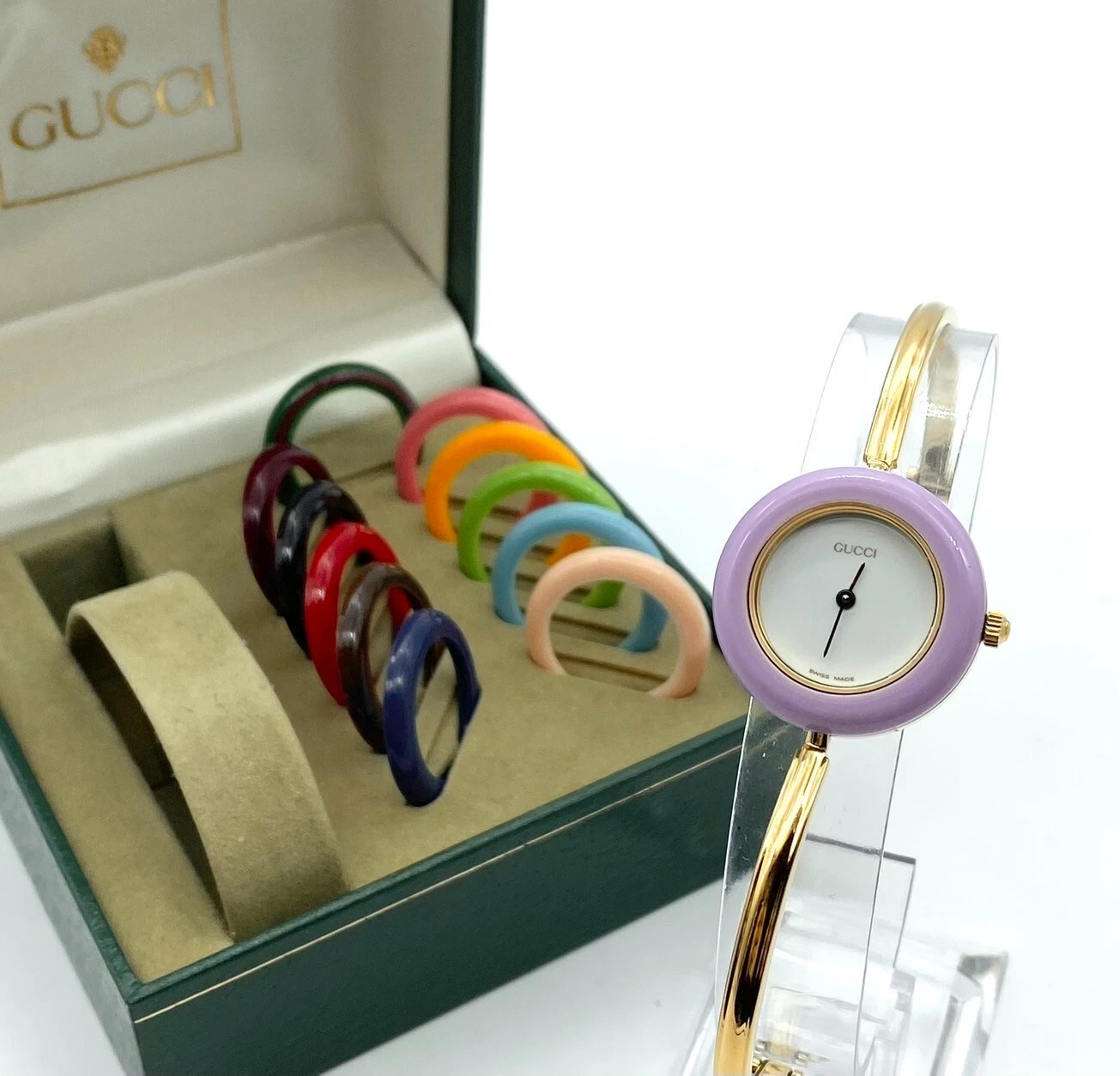Montre femme Gucci lunette changeante 12 couleurs cadran blanc/or en boîte fonctionne