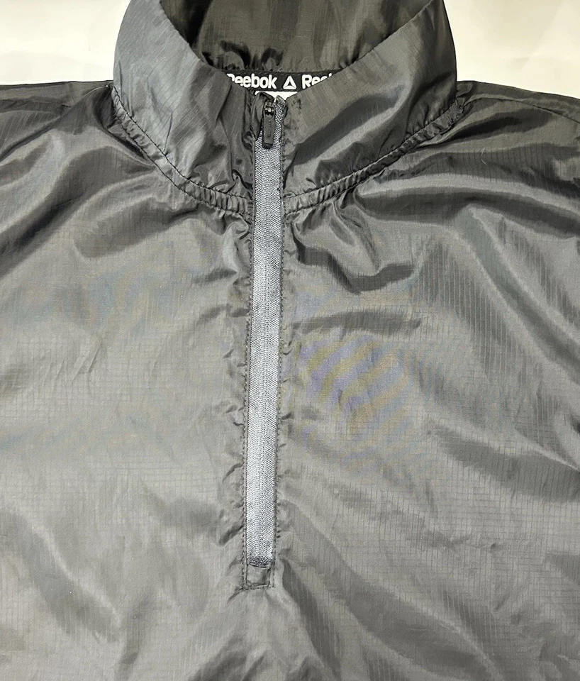 Chaqueta cortavientos Reebok niños 2XL Pullover 1/4 cremallera convertible chaleco para correr usado en excelente estado Foto 3 de 4