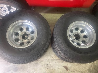 33x12.50R15 Falken Wildpeak A/T Tires + Pro Comp Alloy Wheels 5x5.5 lug pattern