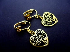 A PAIR OF GOLD TONE HEART TREE OF LIFE THEMED CLIP ON EARRINGS. NEW.