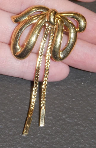 Vintage Monet Polished Goldtone Bow Chain Brooch Costume Jewelry