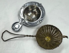 TWO VINTAGE TEA STRAINERS