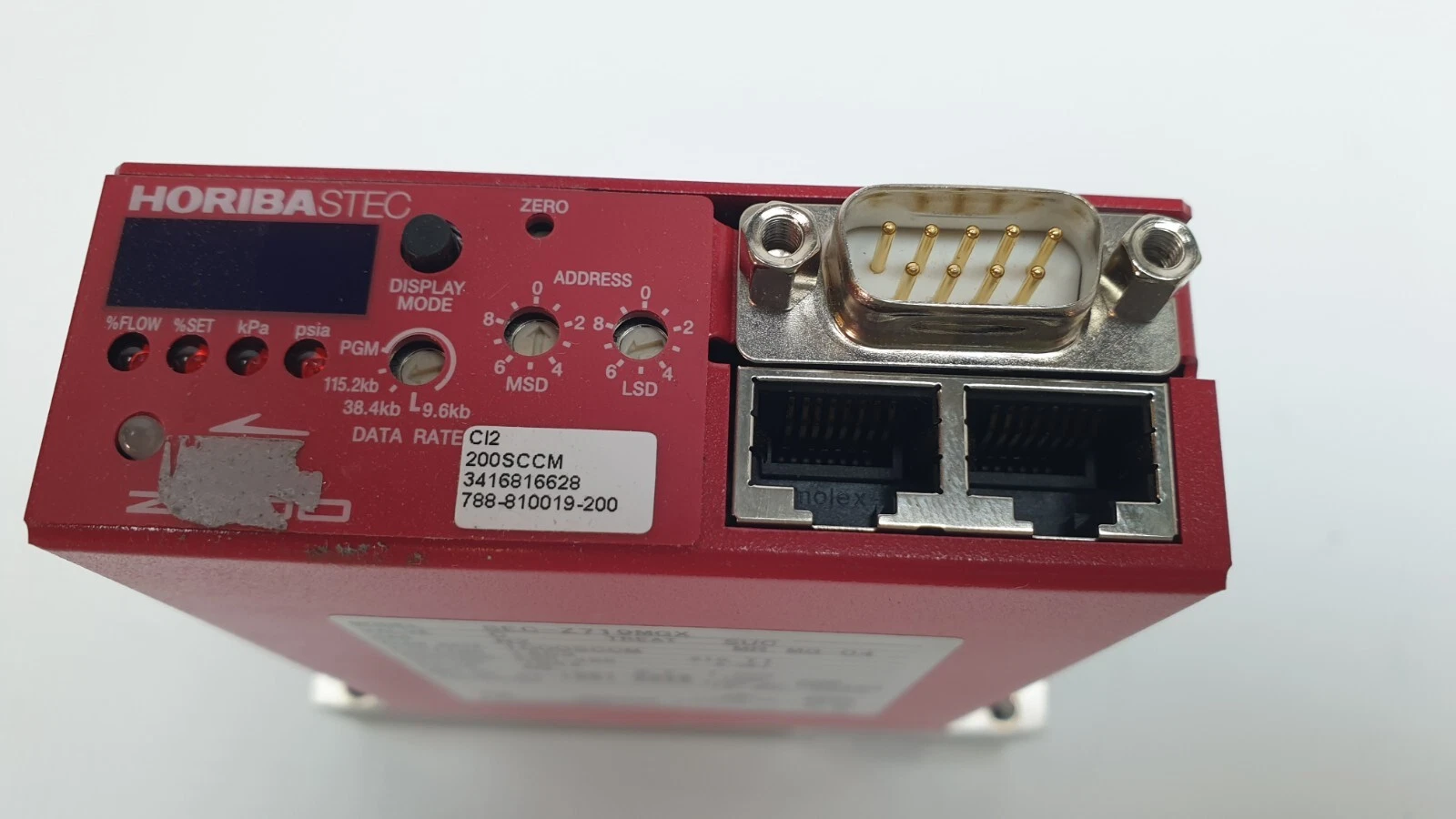 Top of a HORIBA SEC-Z719MGX: display, address switches, D-sub connector and two RJ-45 jacks