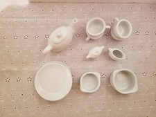 Toy China set 4 plates, tea pot, 4 cups, cream and sugar 2 pots