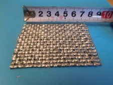 Christo + Jeanne-Claude , Wrapped  1 Stoffstück  ca. 7,5 cm x ca. 5 cm