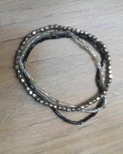 set of 3 small beaded bracelets: 1 black, 1 silver, 1 clear iridescent