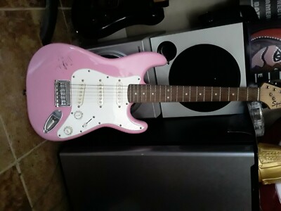 fender squier electric guitar, pink, barley used and also has Nicki Minaj sig.