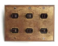 Reclaimed Six Gang Brass Electrical Switch Plate