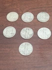 lot of 7 Franklin and walking liberty 90% half dollar coins