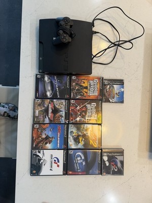 Sony PlayStation 3 With Controllers And Multiple Games Used