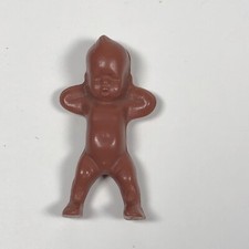 vintage small brown plastic baby miniature infant Made In USA hands behind head