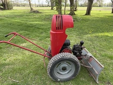 1950 David Bradley  917.57520  walk-behind tractor with a snowplow attachment 