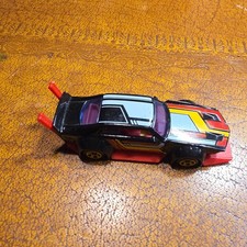 2015 HOT WHEELS MAD MANGA BLACK 1:64 DIECAST 3 1/4 CAR WITH RED BLUE & YELLOW