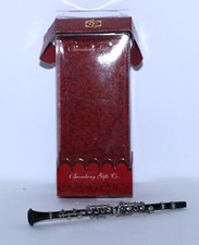 Black Clarinet on White Background: Hyperrealistic Precision in the