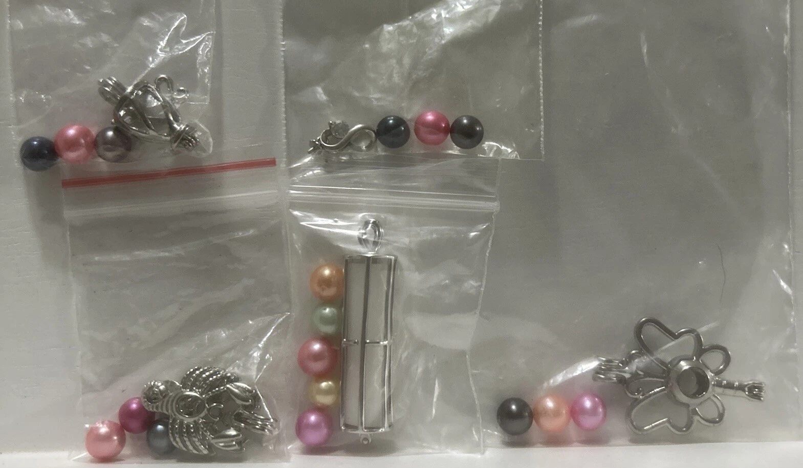 VETEMENTS Lotto di 6 ciondoli gabbia per perle incl perle *vedi descrizione*