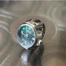 Silver watch ring with green face watch