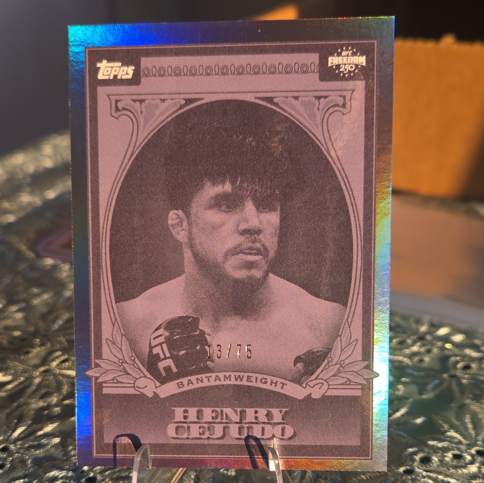 Topps 2026 UFC Freedom 250 Henry Cejudo UFC Dollar UD-11 Serial #13/75