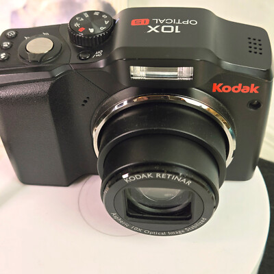 Kodak Z915 10MP 10X Zoom. Also, Makes Videos and Slow Motion. Same