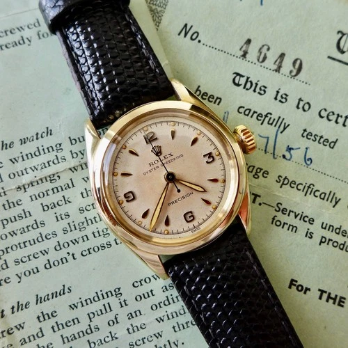 A BEAUTIFUL MID-SIZE VINTAGE 1950s ROLEX OYSTER PRECISION 10ct SOLID GOLD WATCH