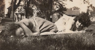 1920s Pretty Women Lying Grass Ground Level POV Resting Relaxing Moment Odd Pose