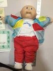 vintage cabbage patch doll with birth certificate & clothing