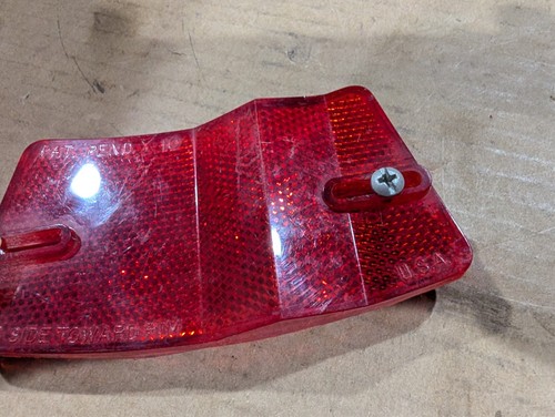 Red vintage 1970s 1980s Micro-Flex bike rim reflector with clear lens, side marker, and embossed “MADE IN U.S.A.” text.