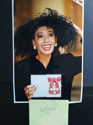SHIRLEY  BASSEY signed page from Airport has a bit missing  from signature 