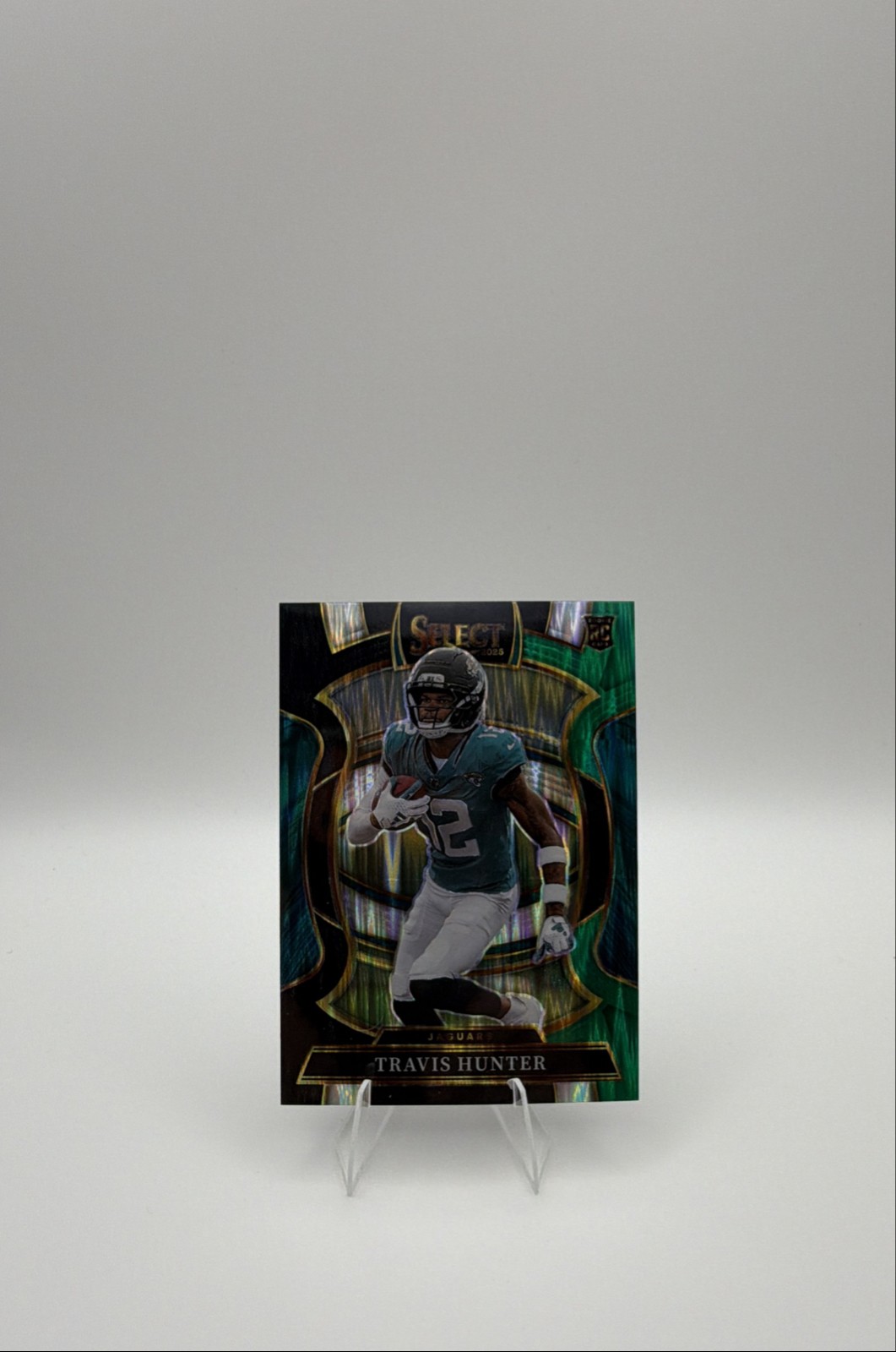 2025 Panini Select - Concourse Travis Hunter #28 Black & Green Shock Prizm (RC)
