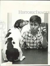 1961 Press Photo James Bailey plays with his dog Sparky in Columbus, Ohio