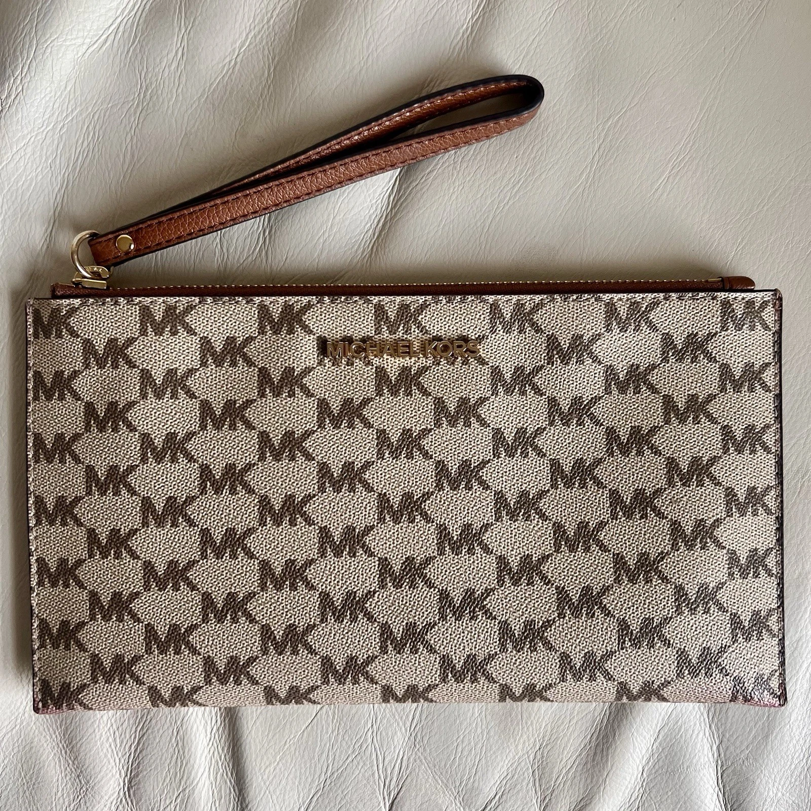 Bracciale Michael Kors Monogram Jet Set in tela rivestito con logo