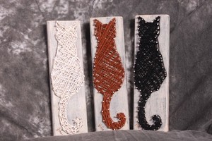 3 piece cat string art with a black, a white and a brown cat 8.5" H x 2.5" W ea.
