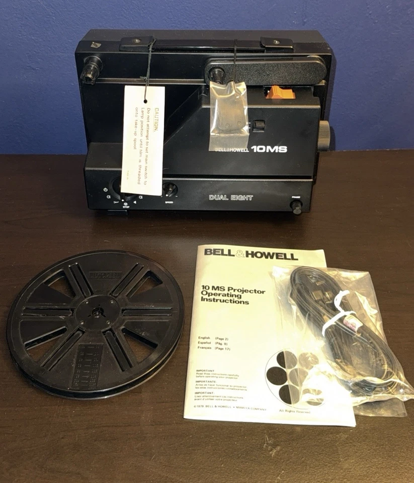 Carrete de película para proyector de películas Bell & Howell 10MS doble de 8 mm incluido como nuevo Foto 2 de 4