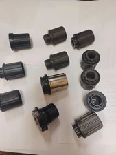 GROUP OF 12 ASSORTED BICYCLE FREEHUB BODIES NEW AND USED SEE DESCRIPTION