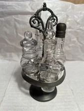 Vintage four-bottle Glass condiment cruet set and metal stand