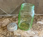 Green Depression Glass jar with screw lid 2 1/2 inches wide 5 inches tall
