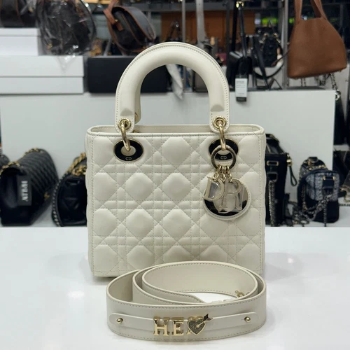 Petite femme Dior blanche et or M0538 124776237