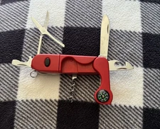 Multi Tool Red Plastic and Stainless Pocket Knife w/ Compass and Light.