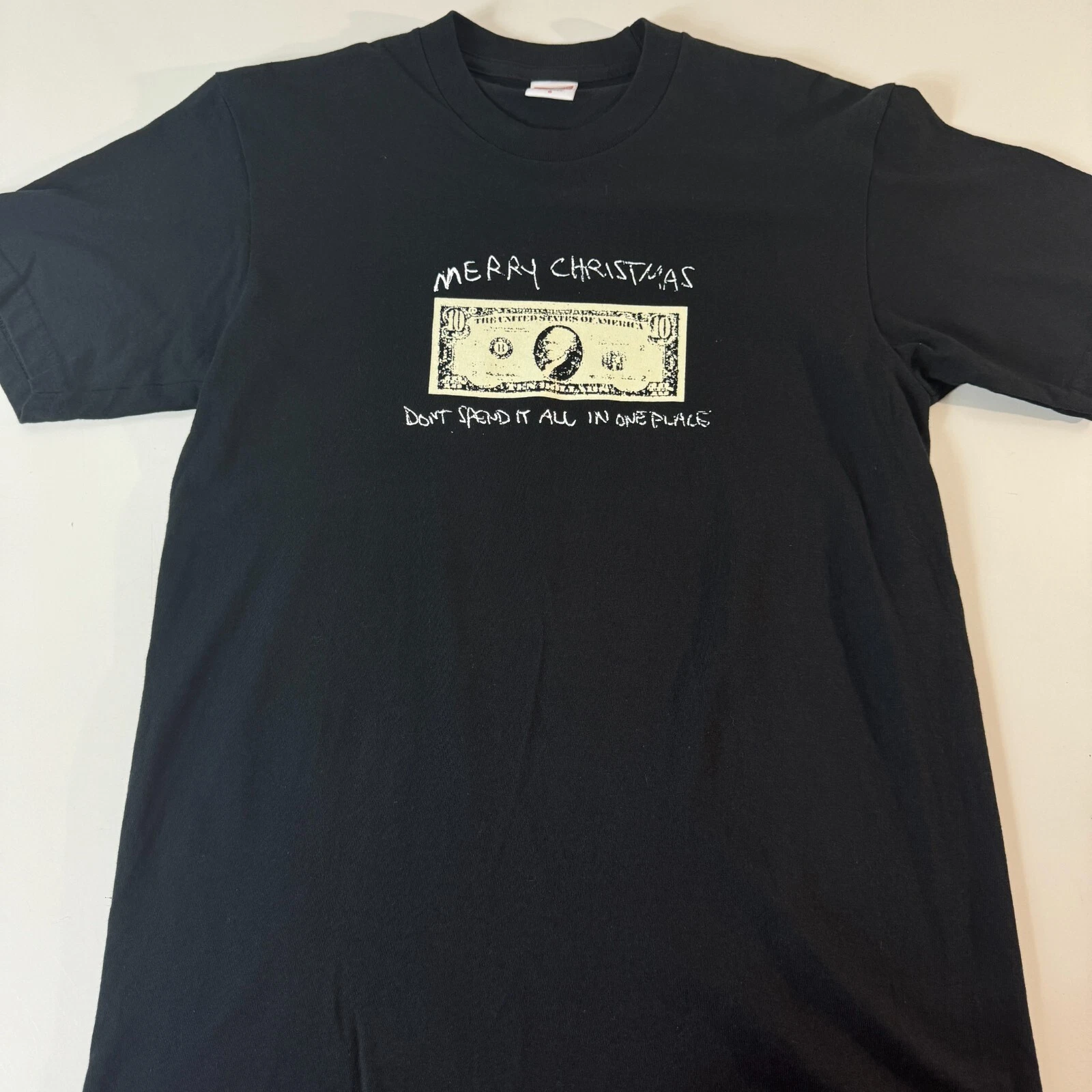 Tee shirt noir Supreme Joyeux Noël Don't Spend It All In One Place taille S NEUF