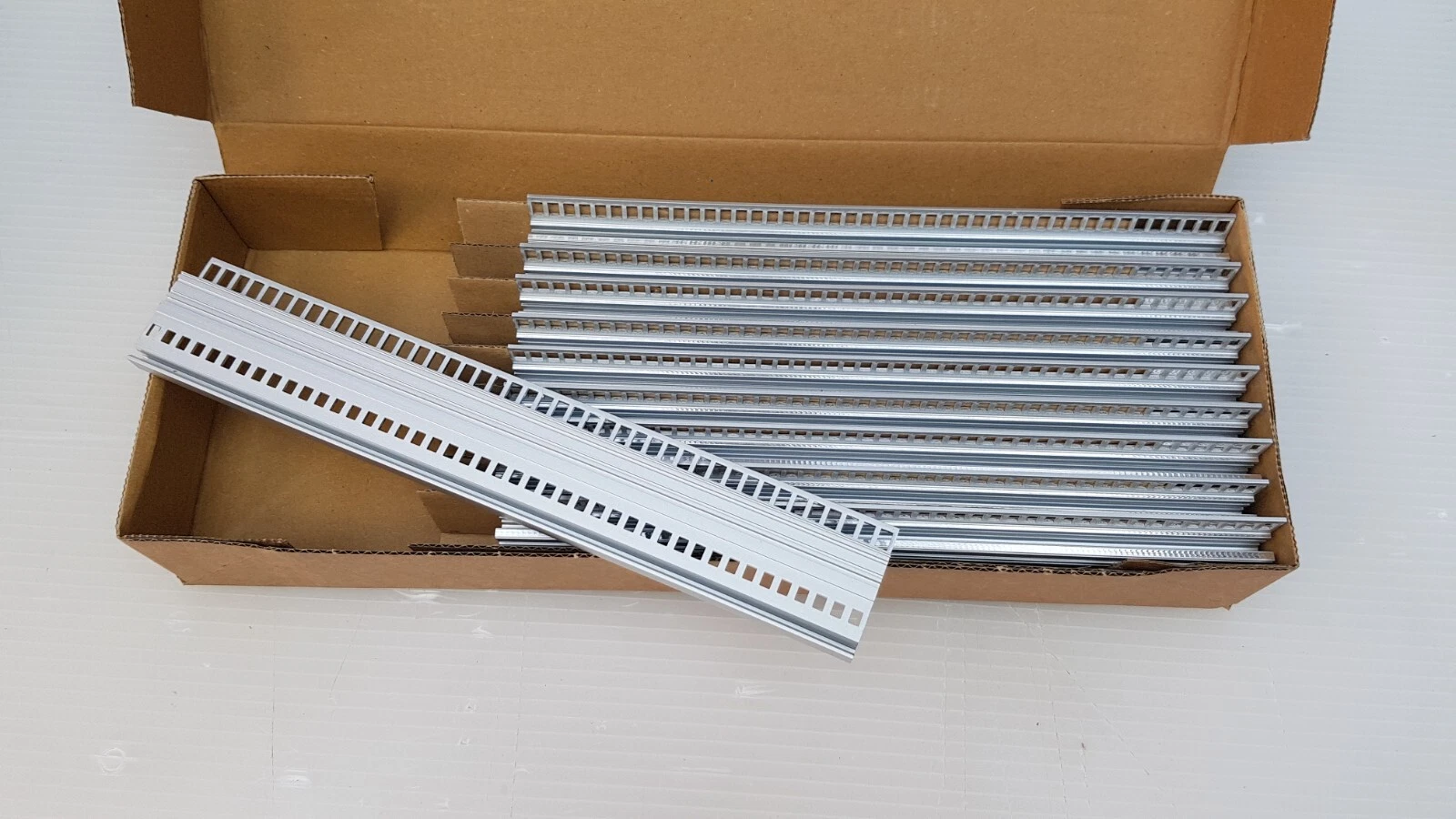 Open box of Schroff 31591126 perforated front rails