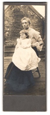 Photograph outdoor shot of a mother with cute girl 