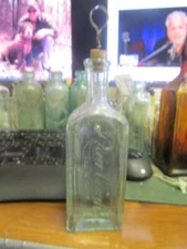 Rawleigh's Freeport, ILL. medicine bottle BIM w/ matching folding corkscrew 