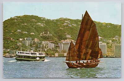 A Modern ferry and an Ancient Chinese Junk Sailing Vessel