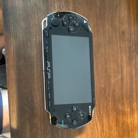 Sony PSP 1000 Console with (5) Games, Battery Pack, Carry Case - Cars, Star Wars