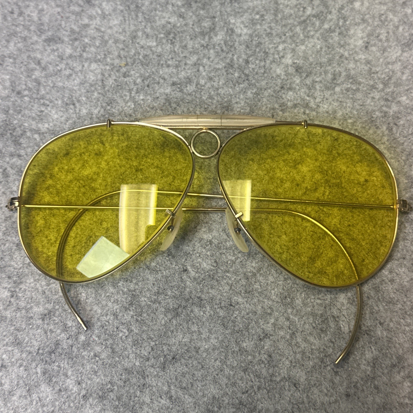 1960s VINTAGE B&L RAY-BAN 8mm BULLET HOLE AMBERMATIC SHOOTING AVIATOR SUNGLASSES