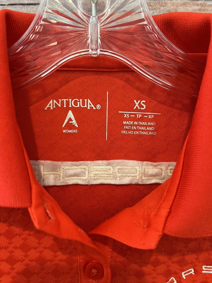 Polo de golf Antigua color rojizo/naranja PORCHE Club of America elástico para mujer XS Foto 3 de 4