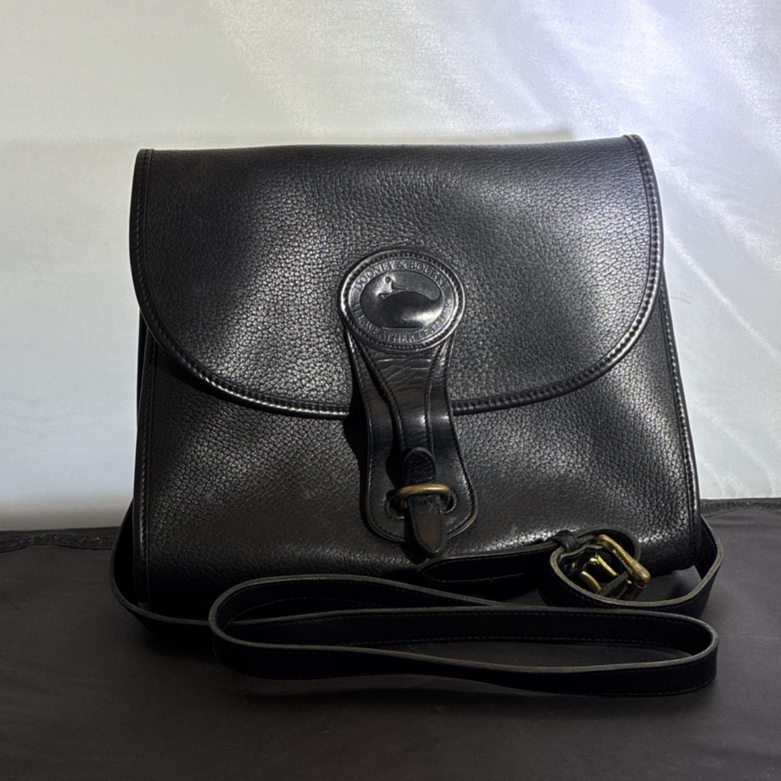 Dooney & Bourke Black Pebbled Shoulder Bag with Buckle & Logo Accent Women's