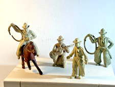 Lot of four Marx vintage 1950's plastic Chubby Cowboys.