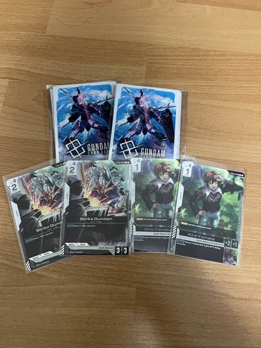 Gundam TCG ST04-002 Strike Gundam, ST04-010 Kira Promo Card, and Sleeves ENGLISH